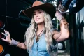 Lainey Wilson spotted snacking on a boat in leopard-print bikini in recent Instagram dump